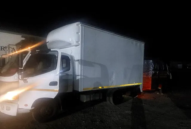 A Lewin Projects removal truck loading after dark to complete a move on schedule